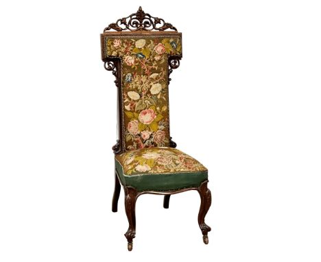 A large Victorian rosewood Prie Dieu chair with original tapestry seat and back on carved cabriole legs. Circa 1860. 49x66x12