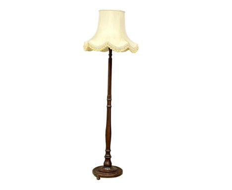 A vintage Mahogany standard lamp. 