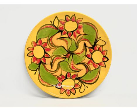 A 1950’s Andree Fontana ‘Delphis’ charger by Poole Pottery. 35cm 