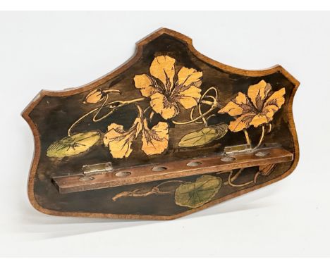 An early 20th century Pokerwork pipe rack. Circa 1900. 31x21cm 