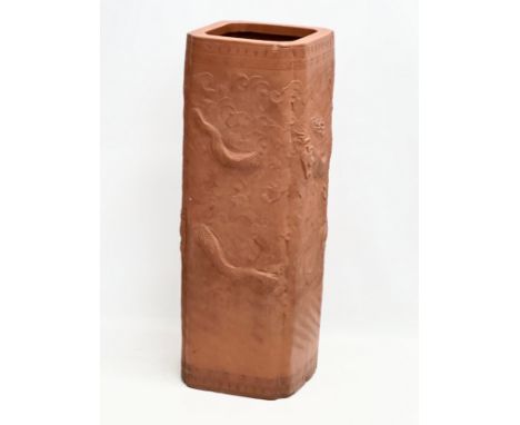 A Chinese terracotta stick stand/planter with dragon motif and Greek Key decoration. 21x21x61cm 