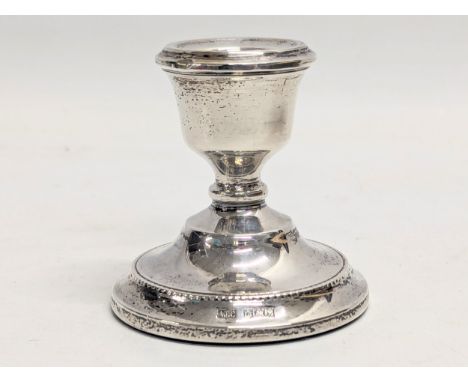 A silver candlestick by A. T. Cannon Ltd. Birmingham, 1973. Total 81g. 7cm 