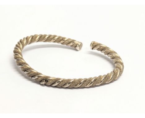 A silver bangle, made in Italy. 15.27g 