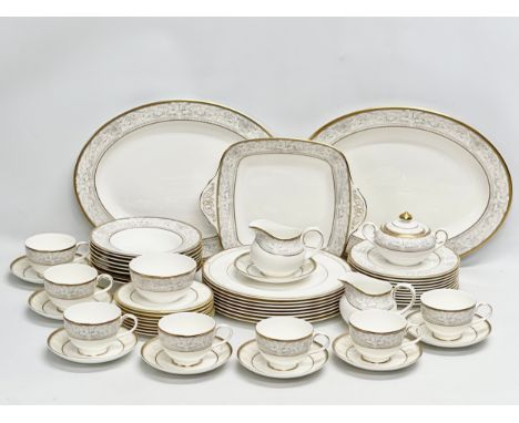 A 56 piece Royal Doulton ‘Naples’ dinner service. A pair of large meat platters 41x31.5cm. A 2 handled cake plate. 8 dinner p