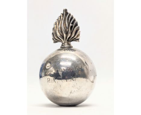 A silver flaming grenade table lighter by Goldsmiths &amp; Silversmiths Co Ltd. London, 1940. Total weight 172.2g. 10cm 