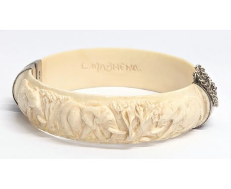 A decorative bangle with silver clasps 