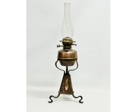 A late 19th century Arts &amp; Crafts copper and wrought iron oil lamp. 24x68cm 