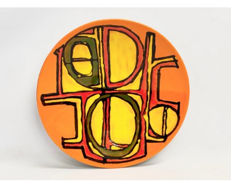 A large Poole Pottery ‘Delphis’ charger/bowl designed by Carol Cutler. 41x6cm 