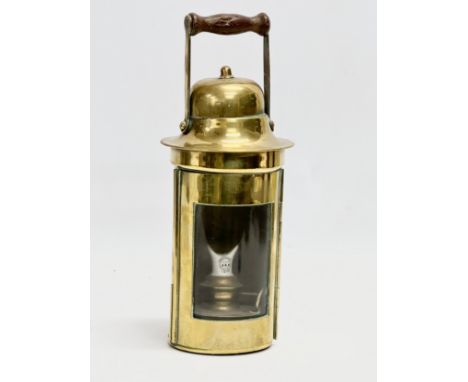 An early 20th century Sherwood Limited brass ships lamp. 26cm including handle. 