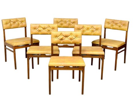 A set of 6 Mid Century teak dining chairs with button back vinyl upholstery. 1960’s.(2) 