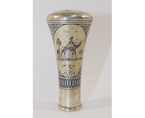 An Iraqi silver niello cane handle, finely decorated with a mosque, a figure riding a camel and a sailing boat, signed, 8.7cm