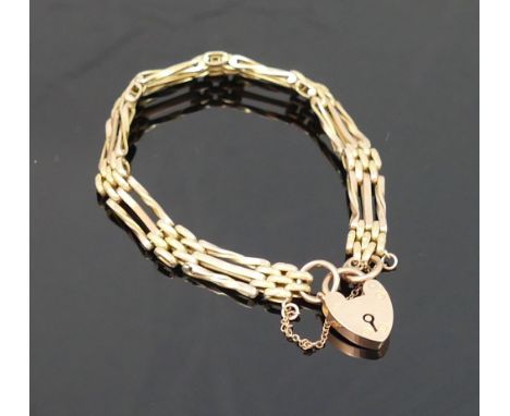 A fancy gate link three-row bracelet, with heart-shaped padlock clasp, bracelet and clasp stamped '9CT', 8.3g grossCONDITION 