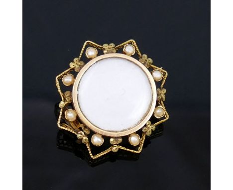 A small French gold seed pearl set brooch, with central circular glazed keepsake panel, and a small emerald and half pearl fi