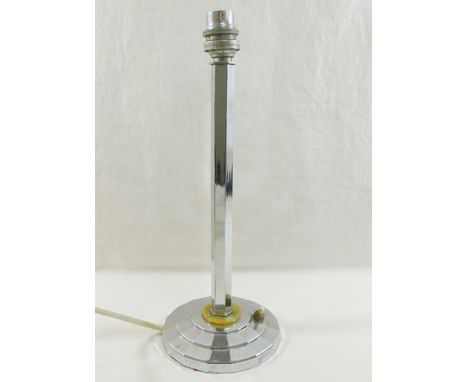 An Art Deco chrome plated table lamp, the hexagonal stem mounted to a Bakelite disc above a circular stepped foot, 32cm highC