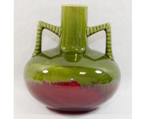 An two-handled pottery vase, possibly Ault Pottery, in the manner of Christopher Dresser, with green and red two-tone glaze, 