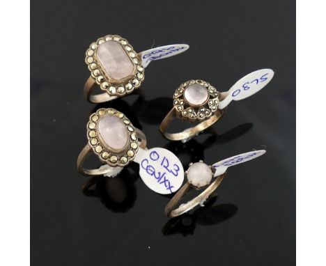 A quantity of rose quartz jewellery, comprised of a three marcasite and rose quartz cluster rings, a small single stone ring,