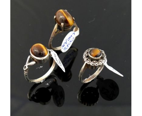 A selection of tiger's eye jewellery comprised of a string of pebble beads, with matching bracelet and drop earrings, a strin