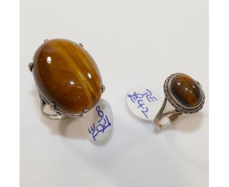 A selection of tiger's eye jewellery comprised of a string of cylindrical beads, a silver tiger's eye set bracelet, an earrin