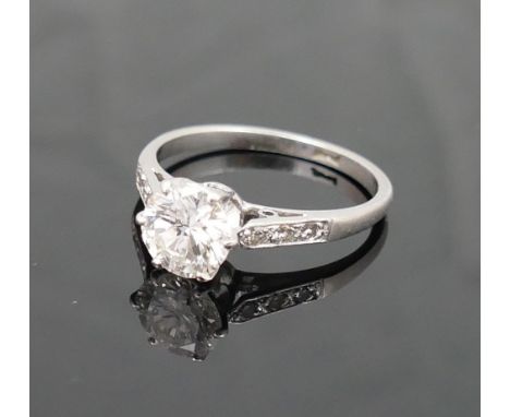 A diamond single stone ring, the round brilliant cut stone approximately 1.23 carats, with visible inclusions, approximate co