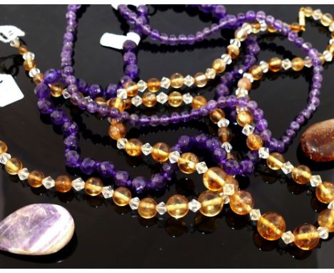 A collection of amethyst and citrine set  jewellery, the amethyst jewellery comprised a faceted bead necklace, a spherical be