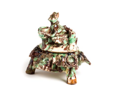 A CANAKKALE SPLASHWARE POTTERY BOWL AND COVER, WESTERN ANATOLIA, LATE 19TH CENTURY   on tripod feet with applique floral deco