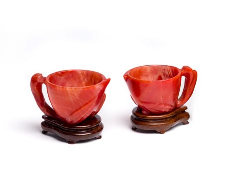 A PAIR OF CHINESE AGATE 'PEACH' CUPS, EARLY 20TH CENTURY  each body of hollowed peach form set to the side with a leafy branc