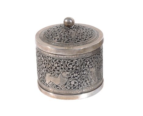 A SILVER BOX, SRI LANKA, 19TH CENTURY  of cylindrical form, with chased decoration, the lid with ball finial, with design of 