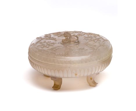 A CHINESE JADE BOX AND COVER  compressed circular, the cover carved with Buddhist lion finial surrounded by low relief traili