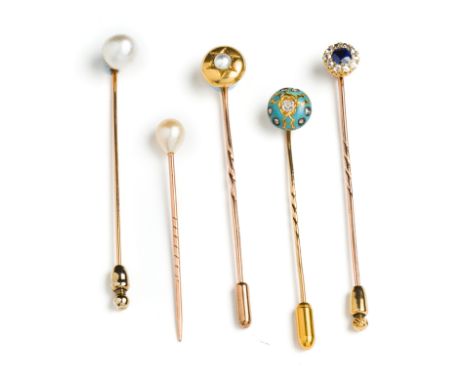 COLLECTION OF TIE PINS  comprising: two with pearl terminals one drop shaped, one bouton; a circular topped pin with  starbur