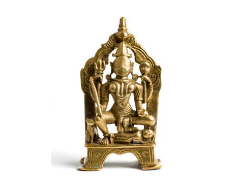 A BRASS FIGURE OF BHADRAKALI, GUJARAT, WESTERN INDIA, CIRCA 16TH CENTURY   the four-armed goddess holding sword, bowl, khatva