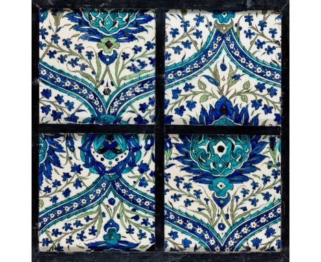 A PANEL OF FOUR DAMASCUS TILES, OTTOMAN SYRIA, LATE 16TH CENTURY  glazed fritware, underglaze painted in the 'Piyale Pasa' de