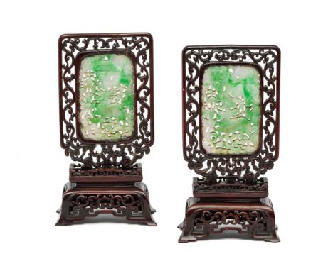 A PAIR OF CHINESE JADEITE PLAQUES, EARLY 20TH CENTURY  each rectangular plaque carved and pierced with a kylin amidst foliage