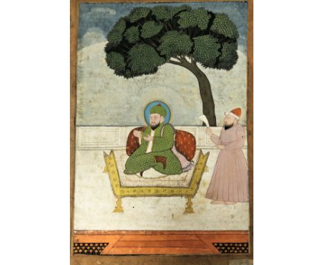 A PORTRAIT OF A MUSLIM HOLY MAN, DECCAN, SOUTHERN INDIA, 18TH CENTURY   gouache with gold on paper, wearing green brocade coa