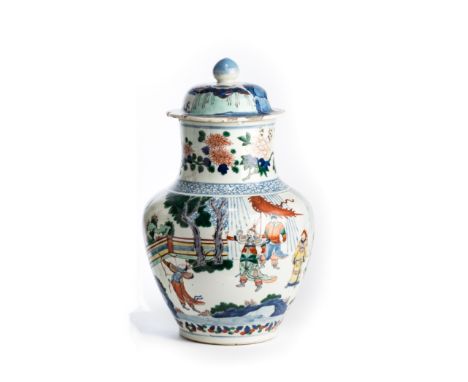 A CHINESE WUCAI VASE AND COVER, 19TH CENTURY  oviform, decorated with an archer displaying his skill to figures ranged behind