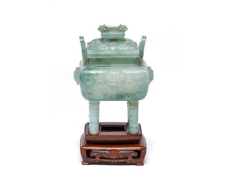 A CHINESE ARCHAISTIC JADEITE CENSER AND COVER, 20TH CENTURY  the compressed square body rising from four cylindrical legs to 