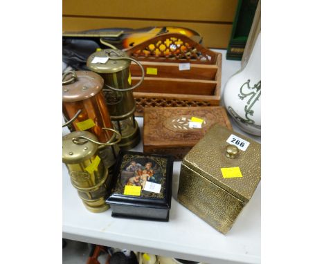 Three reproduction miners lamps, a brass tea caddy etc