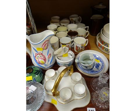 A quantity of mixed pottery & china including commemorative items, an egg cup caddy etc