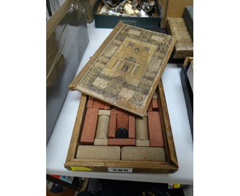 A child's 1880 wooden boxed architectural building-blocks set