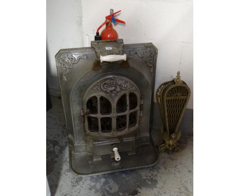 A French cast iron salamander fire together with a brass peacock feather fireguard (A/F) E/T