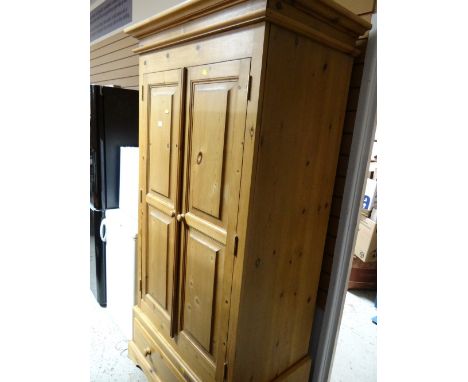 A good two-door pine wardrobe with single-drawer base
