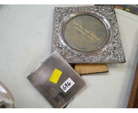 A twentieth century silver easel portrait mirror together with a silver machine turned cigarette case