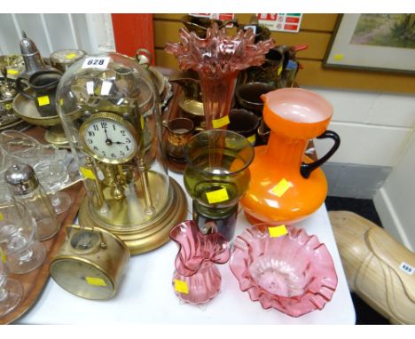 A glass dome rotary clock & a drum-style table clock