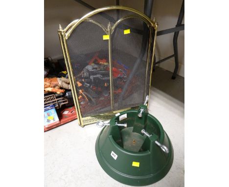 A modern plastic Christmas tree stand & a brass effect fireguard