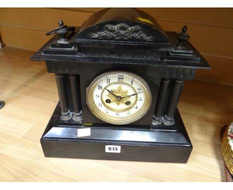 An antique architectural slate mantel clock