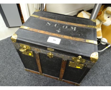 A turn of the century French canvas cabin steamer trunk with brass fittings, wooden banding &amp; having printed lettering &a