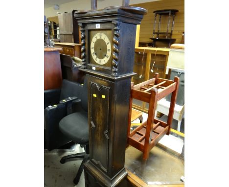A vintage dark oak grandmother clock (distressed) together with a pair of wooden smoker's companions