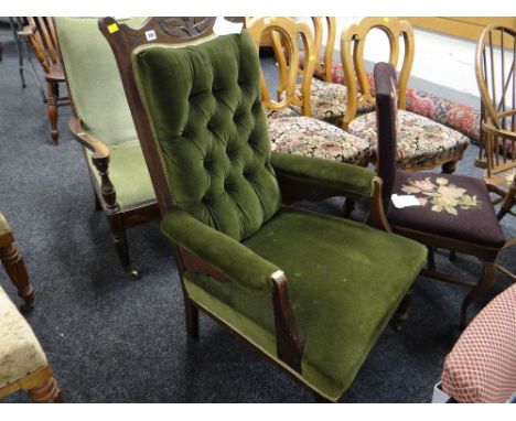 A button upholstered antique elbow chair