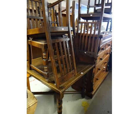 A vintage oak pullout extending dining table with barley-twist cross stretcher base together with six matching high back dini