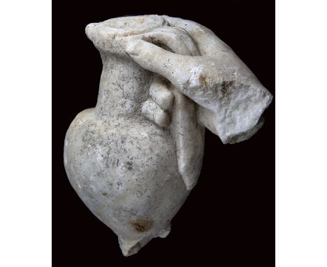 Hand of the young Dionysus1st century AD; alt. cm 20; A thick grained marble section of a right hand originally part of a lif