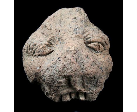 An Etruscan lionEtruria, 5th – 4th century BC; alt. cm 14; The central section of a leonine head; eyes with incised pupils, t